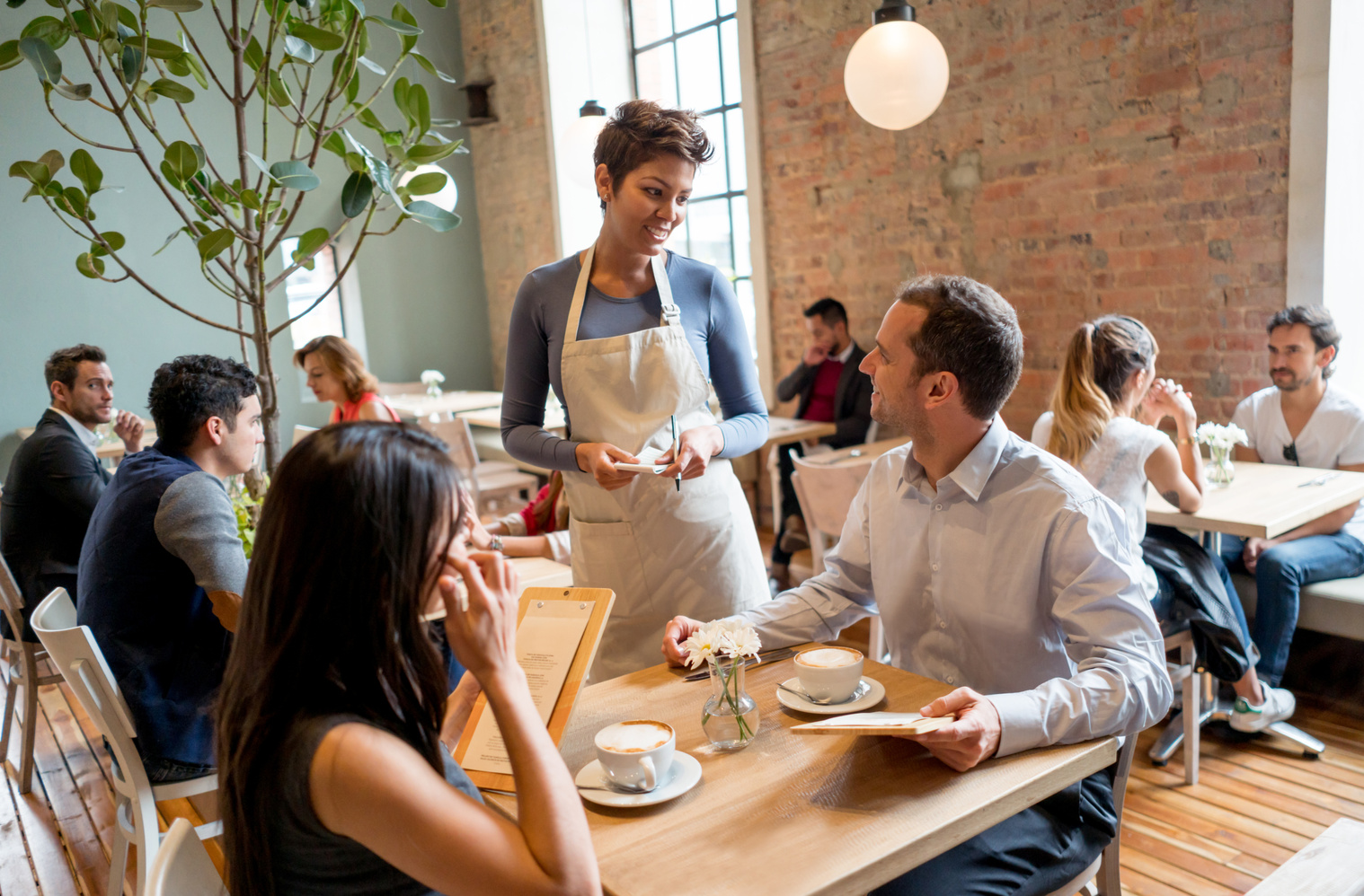 Waitress serving people at a restaurant